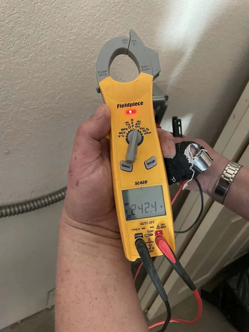 Voltage testing with clamp meter during Electrical Installation Services in Poteet